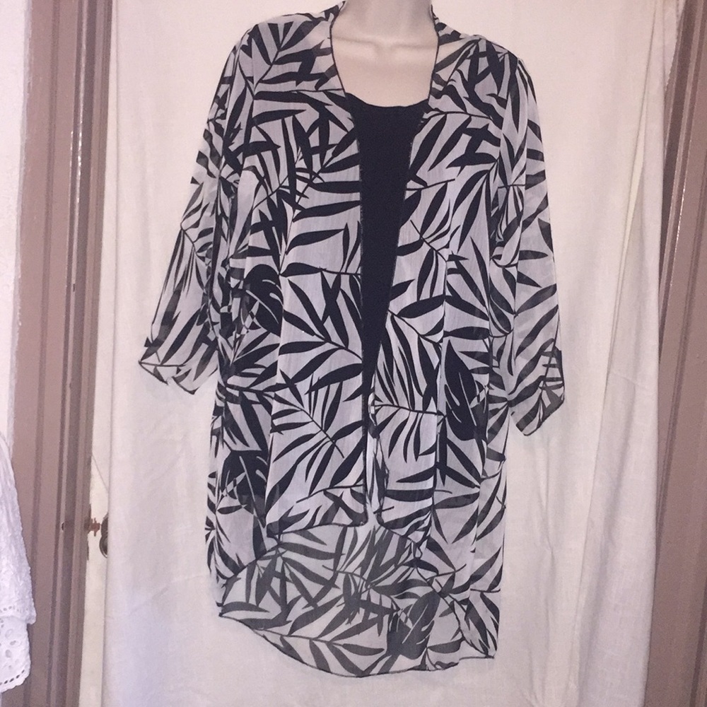 Polyester black/white coverup.  3/4 length sleeves